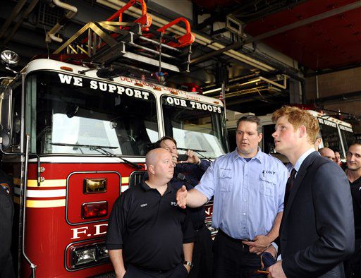 Prince Harry speaks with Cpt. Joseph McHugh and firefighter Anthony Henry of the New York City Fire Department's Ladder 10/Engine 10 after visiting the site of the Sept. 11 terrorist attack